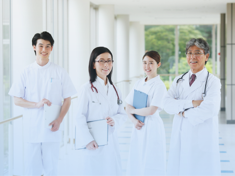 A group of smiling medical professionals at Titan Medical